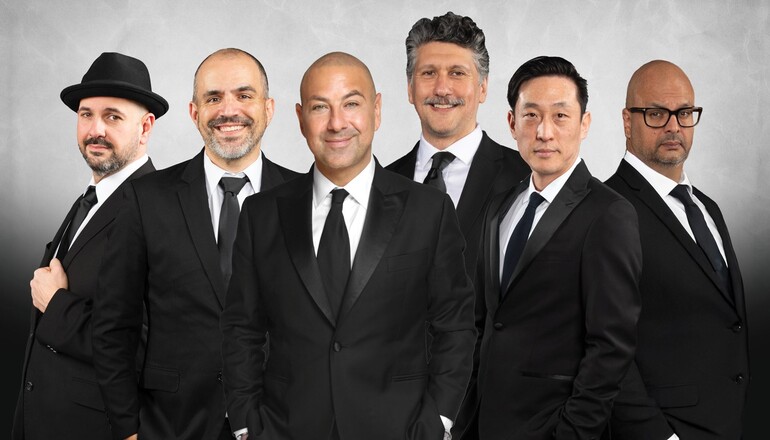 Image of comedians performing in this event wearing suits