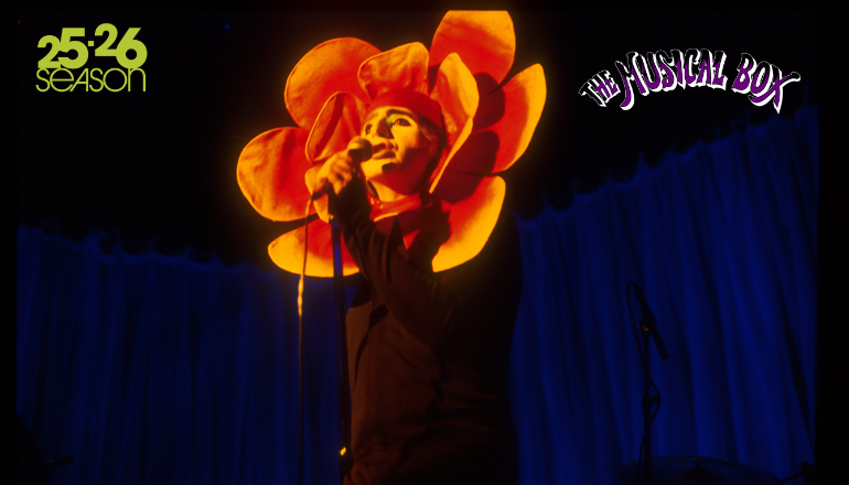 Image of The Musical Box being performed live on stage. A performer is dressed in an orange flower headpiece and is singing onstage. The 25.26 RHCPA Presents Season logo is in the top corner of the image. Text reading "The Musical Box" is in the opposite top corner